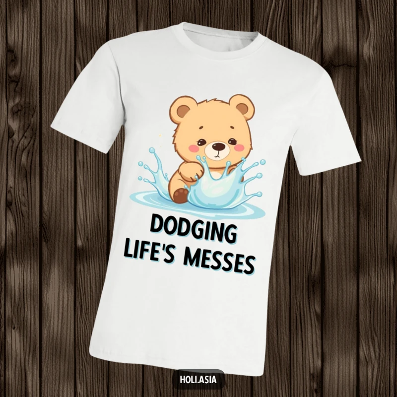 Funny T-Shirt: A curious bear cub is caught mid-dodge, playfully evading a splash of vibrant, bright liquid.